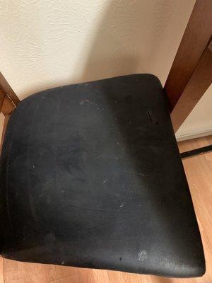 Dirt covered chair.