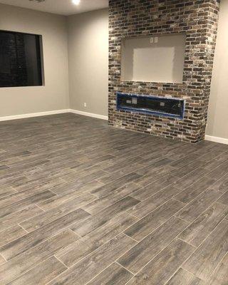 Stone at fire place and flooring, lighting, baseboard and paint