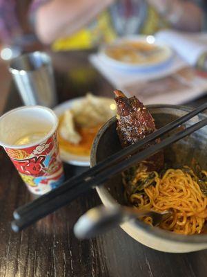 During my second visit I ordered appetizers, cold sake and the ribs with ramen noodle!  Oh my!