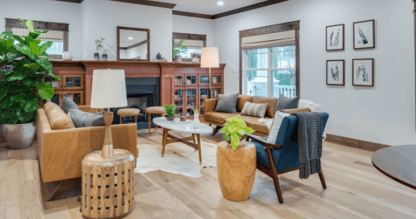 This finished living room was outfitted with Mohawk's Sand bridge hardwood flooring in Country Natural Hickory