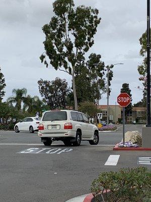 Reckless driver- white middle-aged blonde female driving gold Lexus with license 76CH799.