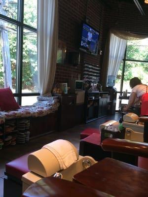 Cozy seating with a great view window, flat screens, and friendly service.