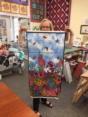 An example of a beautiful panel available at the shop, held by Cookie.