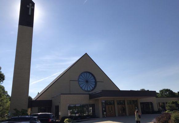 Bell tower silhouetted by sun