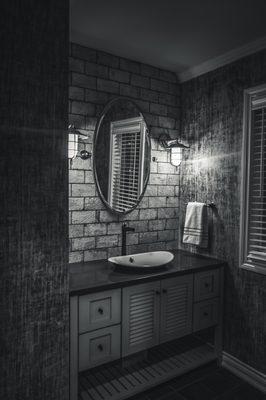 Everyone loves the mood of this powder room. Faux "linen" finish on walls was created just for this home.