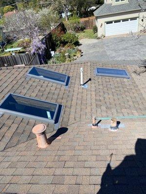 New skylights above garage and storage area. You can hardly tell where the old roofing stops and the new stuff begins!