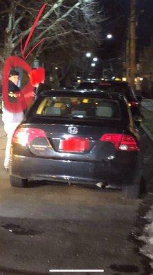 The tow truck driver yelling at the people he was blocking in the road.