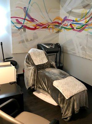 Sandra Day of NeoDerm Aesthetics comfy procedures chair.