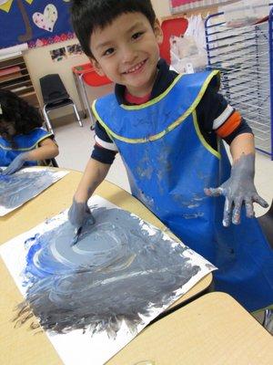 We love getting our hands messy while painting pictures!