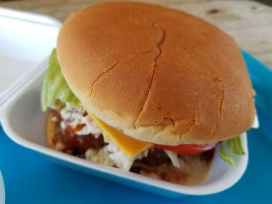 Large cheeseburger with slaw and BBQ sauce