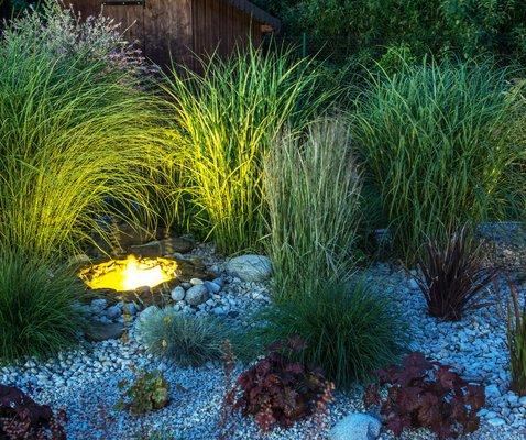 River rock landscape has become a very popular low maintenance landscape option due to the natural beauty and aesthetic.