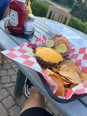 Burger and homemade chips.