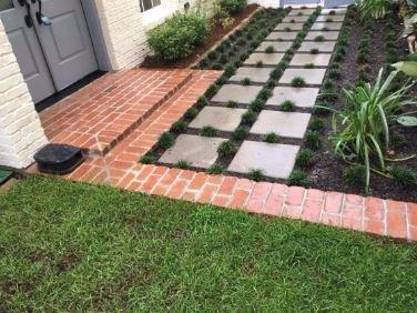 A new brick porch with a stone paver walkway