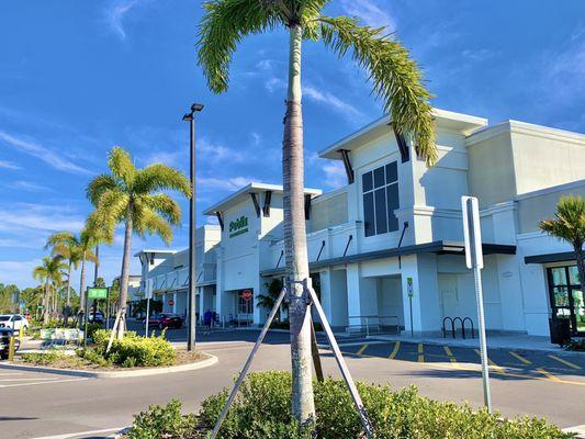 Publix is the anchor store in the center of the strip mall.