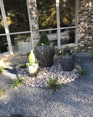 Pots installation with river rock and black tejas