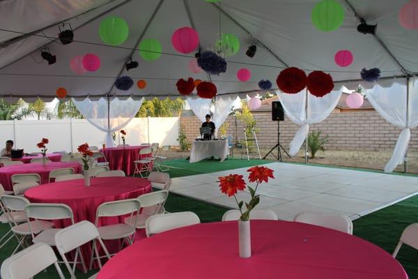 Rented tent, astroturf, pole drapery, tables/chairs and table clothes