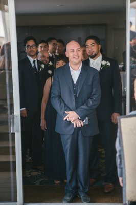 Mike Bell leads the wedding party into the ceremony.