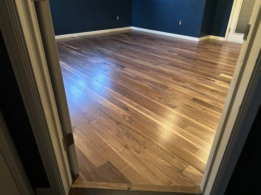 Hardwood flooring - walnut unstained with water based sealant.