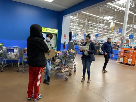 Three members of staff reshopping my cart.