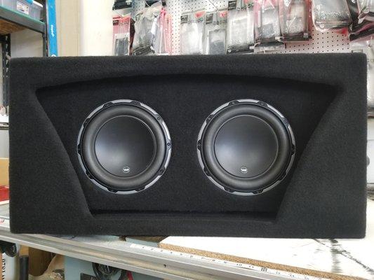 Custom box for two JL audio subs playing off the old Red eye boxes.