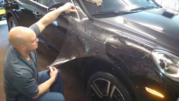 Xpel Paint Protection Film being applied to 2016 Porsche Cayenne