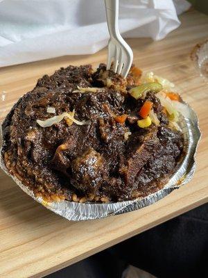 Oxtail, Cabbage and rice and peas , this is a lot (mostly rice) for 21 dollars