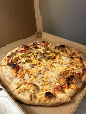 Cheese pizza with half hot sausage