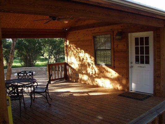 covered breezeway adjacent to firepit area