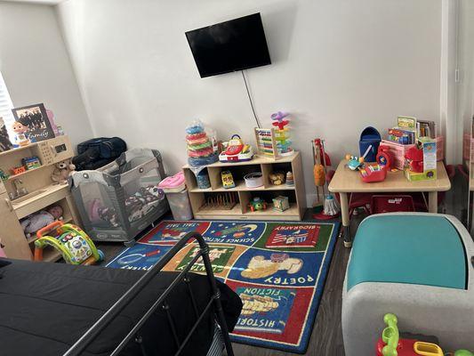 This is my daycare room we spent most of the day we watch Miss Rachel. We do games and also reading time. And napping room?