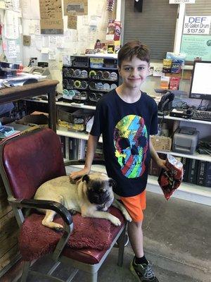 Lounging in the storefront while waiting on our oil change.