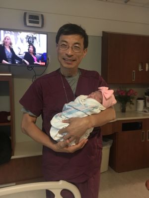 Dr.Pei and my baby girl a day after delivery when he came to check up on my recovery