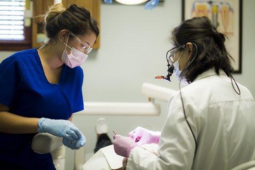 Our Hygienist Caroline working alongside Dr. Lee