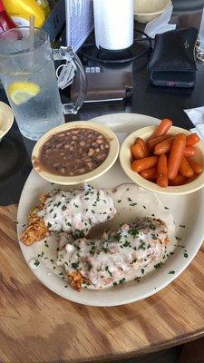 Fried chicken tenders with white gravy, candied carrots and black eyed peas.