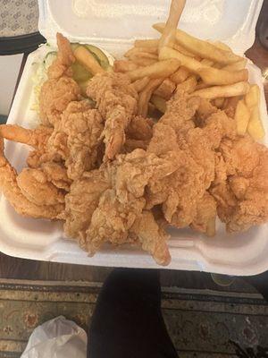 Shrimp and fries with salad