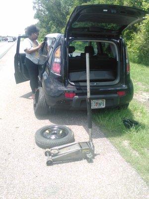 As you can see in this photo, this customers car blew a tire on busy Interstate 4. I was able to stop and help this young lady out with fast