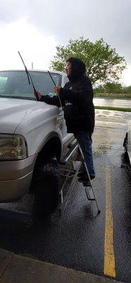 Jose installing my wipers in the rain