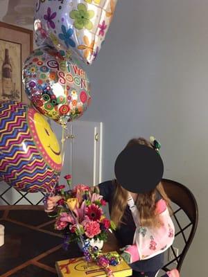 Balloons, chocolate, and flowers.