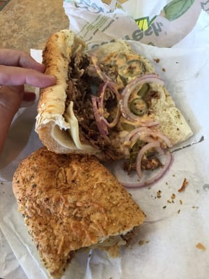 Footlong steak and cheese with chipotle sauce, red onions, pickles and jalapeños. $11 after tax.