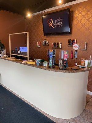 Check-in desk, with added sneeze guard for client and employee safety