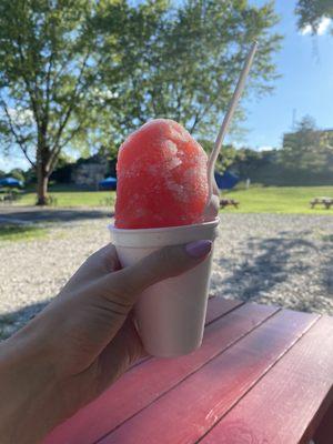 Strawberry snow cone with vanilla ice cream on bottom