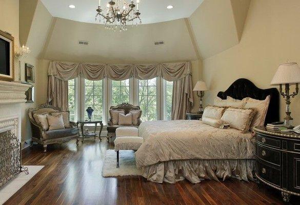 This room was decorated to relax & unwind in.  Soft swags & drapes captivate the window area and the complimentary bedding is stunning!