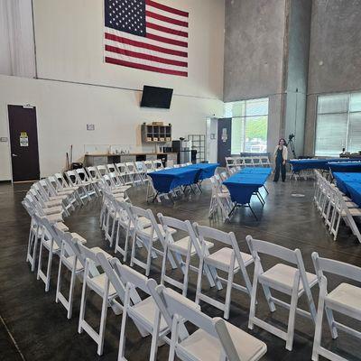 Garden chairs with rectangular tables for employee training session