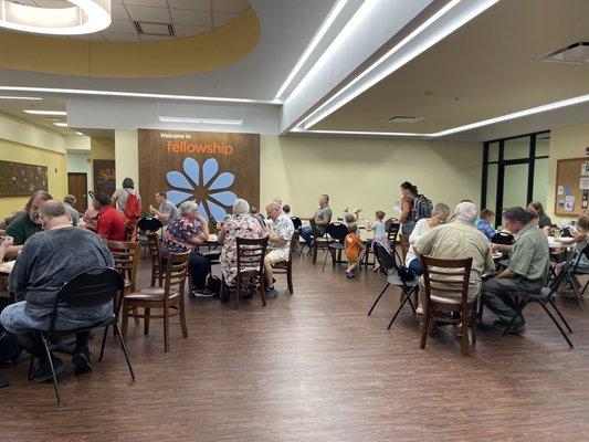 Eating together after a Saturday evening service