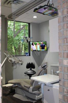 Treatment Room with ceiling mounted TVs