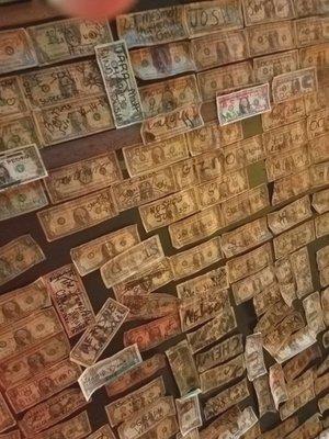 Ceiling and walls covered with hundreds of $$!