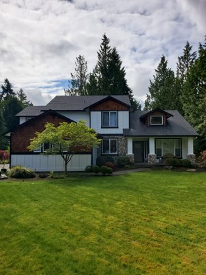 White with black trim. We removed existing shingles and installed new.