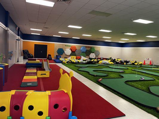 A glimpse of our toddler area! What's that I spy in the back corner? Massage chairs!! Perfect for parents to relax while kids play!