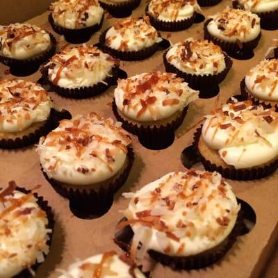 Caramelized Pineapple with coconut buttercream dipped in toasted coconut then drizzled with caramel!