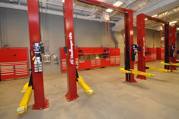 A car dealership with 10,000 LBS 2-post lifts.