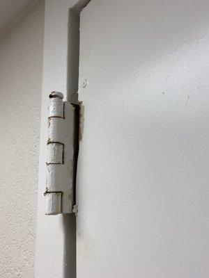 Broken door hinge